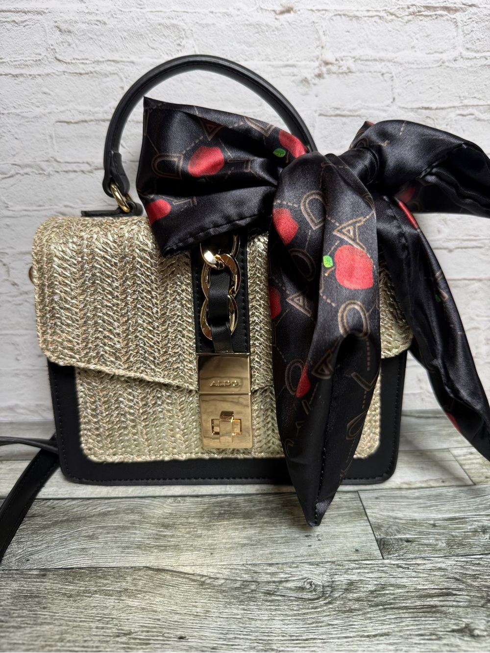 Aldo Gold Woven Shoulder Bag with Black Trim and Scarf Accent